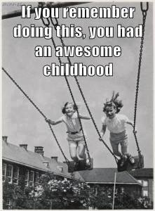 girls standing up on swing set