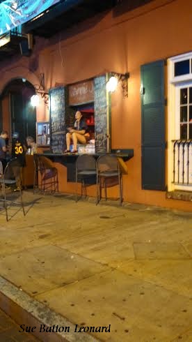 girl sitting on window sill signed